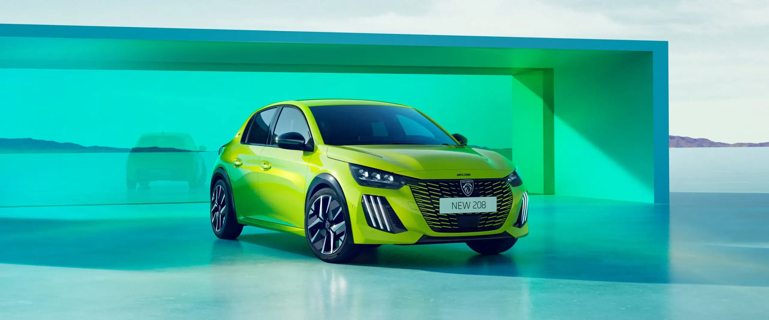 Nový Peugeot 208 v limetkovo zelenej metalíze Agueda – pohľad spredu na mestský hatchback